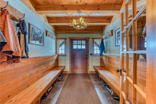 mudroom featuring beamed ceiling, plenty of natural light, and wooden ceiling