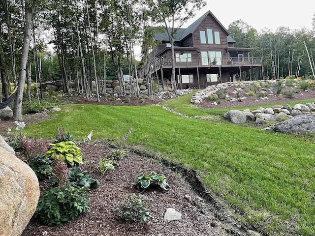 view of yard featuring a wooden deck