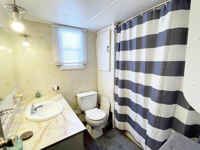 bathroom with vanity, a shower with shower curtain, a textured ceiling, and toilet