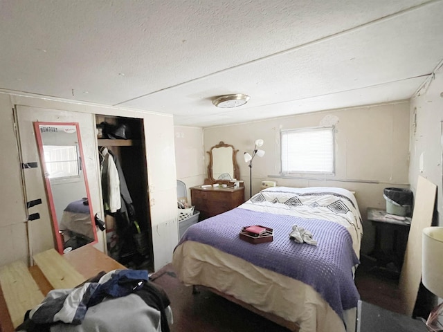 bedroom with a closet and a textured ceiling