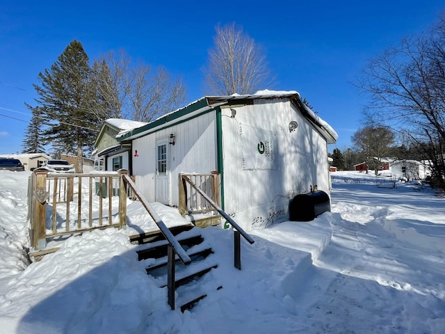 view of snow covered house