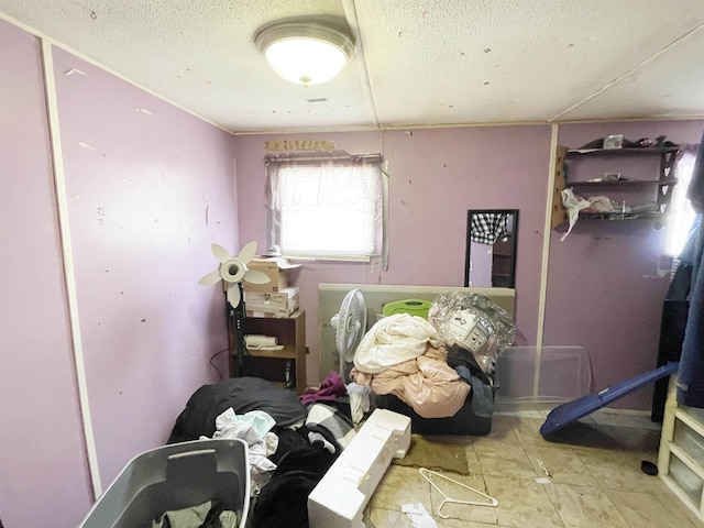 miscellaneous room with a textured ceiling