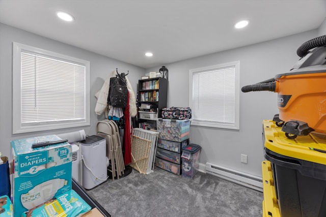 storage room with a baseboard heating unit