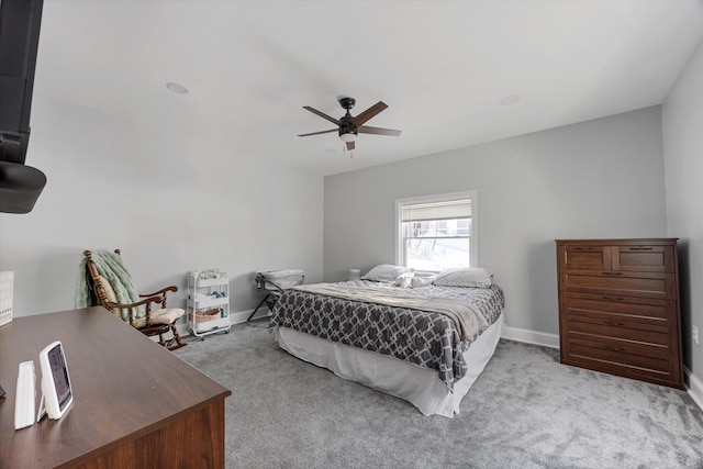 bedroom with light colored carpet and ceiling fan