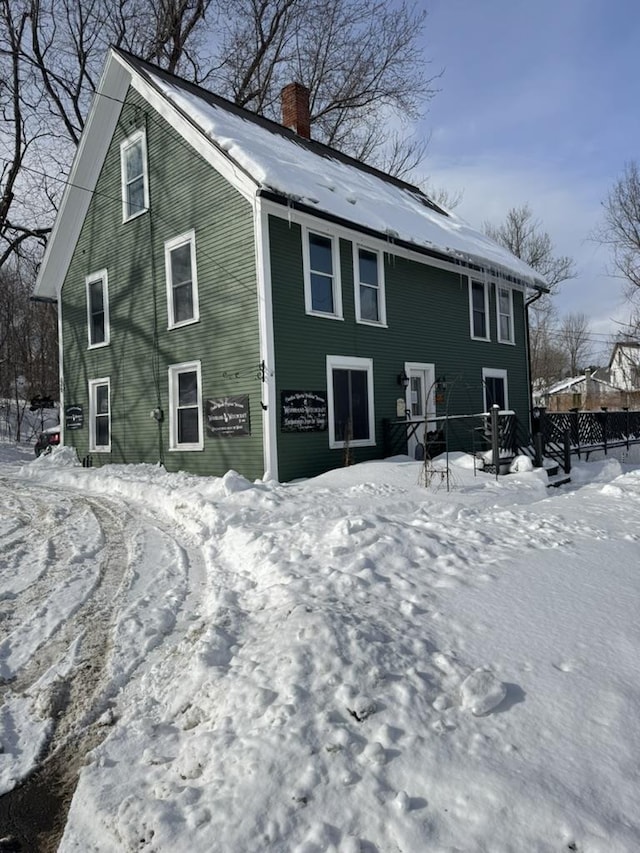 view of snow covered property