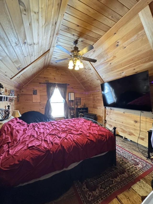 bedroom featuring vaulted ceiling, wooden ceiling, and wood walls