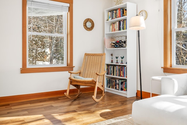 sitting room featuring hardwood / wood-style flooring and a wealth of natural light