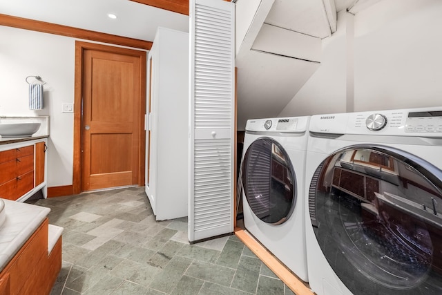 clothes washing area featuring sink