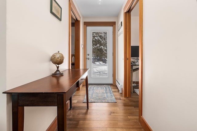 entryway with baseboard heating and dark hardwood / wood-style flooring