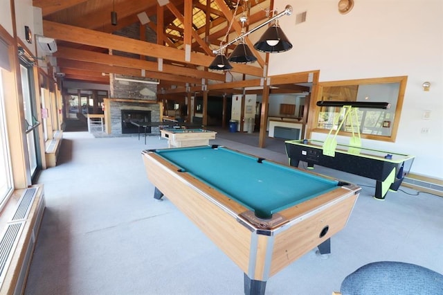 game room featuring billiards, an outdoor stone fireplace, high vaulted ceiling, and a wealth of natural light