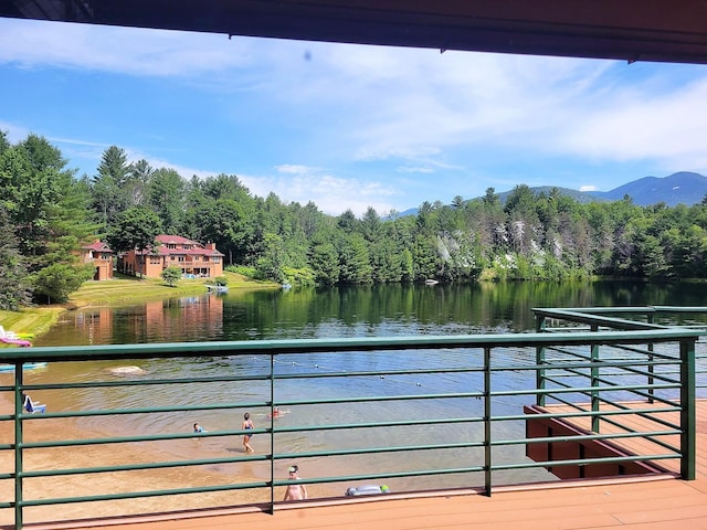 view of pool with a water and mountain view