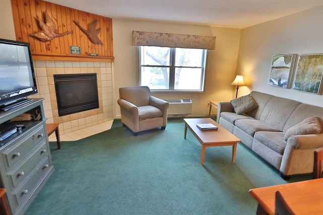 living room featuring a wall mounted air conditioner, a fireplace, and dark colored carpet