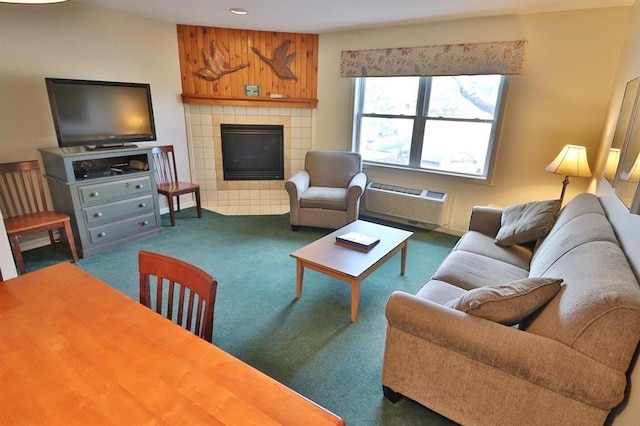 living room featuring a tile fireplace, a wall mounted AC, and dark carpet