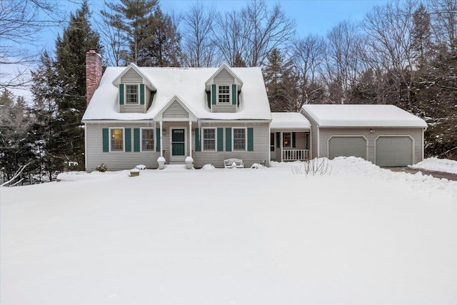 cape cod-style house featuring a garage