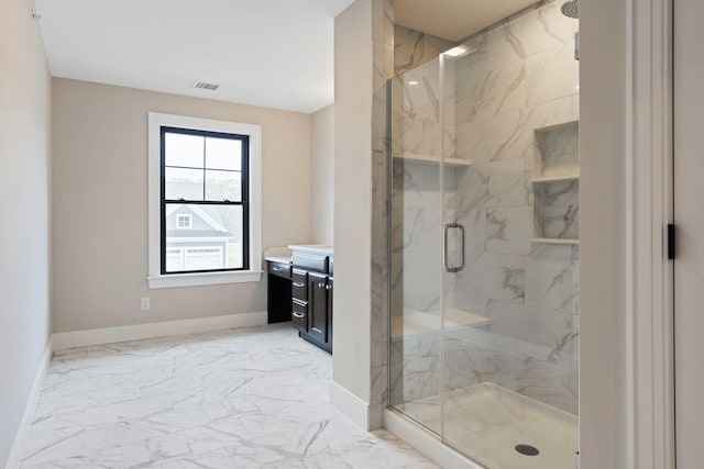 bathroom with walk in shower and vanity