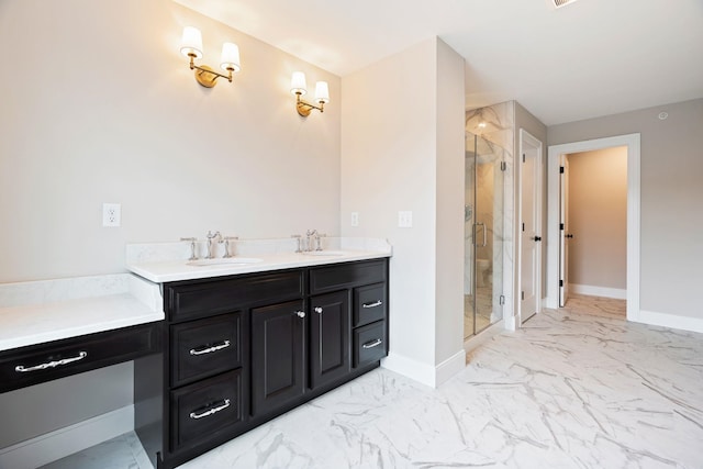 bathroom with a shower with door and vanity