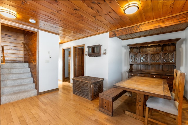 dining space featuring wooden ceiling and light wood-type flooring