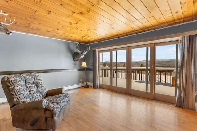 living area with wood ceiling, light hardwood / wood-style flooring, french doors, and baseboard heating