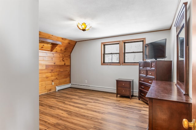 office area with a baseboard heating unit and light wood-type flooring