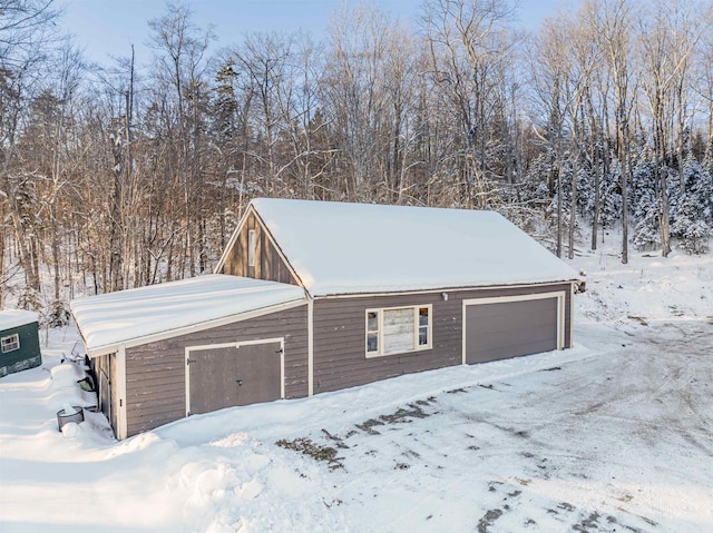 view of snow covered garage