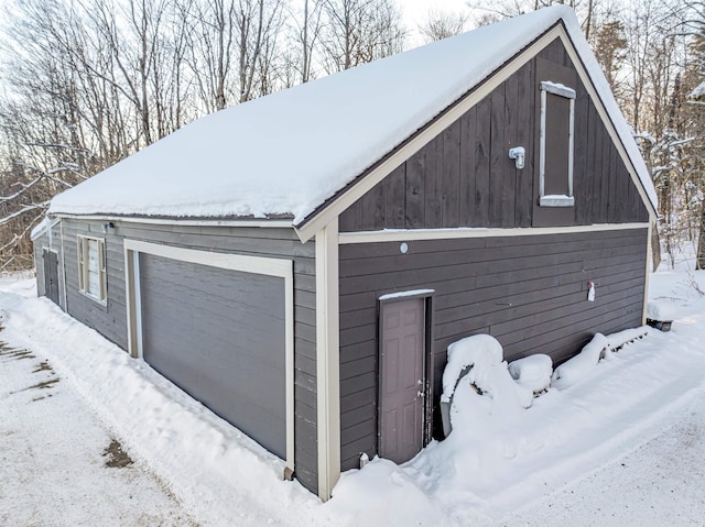 view of snow covered garage