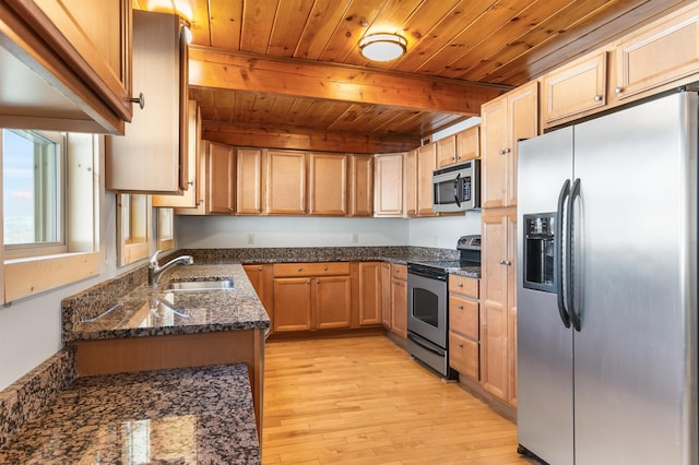 kitchen with sink, wooden ceiling, appliances with stainless steel finishes, dark stone counters, and light hardwood / wood-style floors