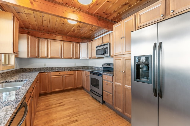 kitchen featuring appliances with stainless steel finishes, beamed ceiling, dark stone countertops, wooden ceiling, and light wood-type flooring