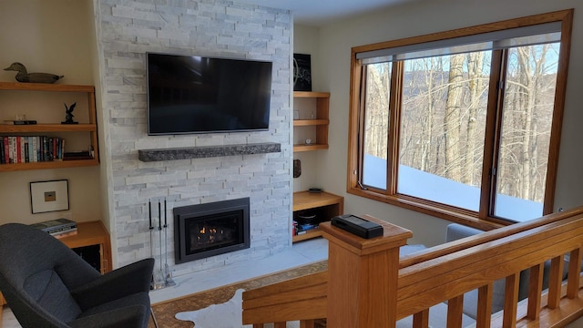 living room featuring a fireplace