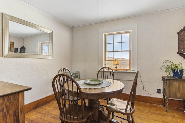 dining space featuring light wood-type flooring