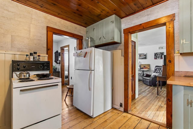 kitchen featuring white appliances, light hardwood / wood-style flooring, and wooden ceiling