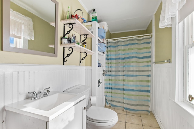 bathroom with ornamental molding, tile patterned flooring, toilet, and a wealth of natural light