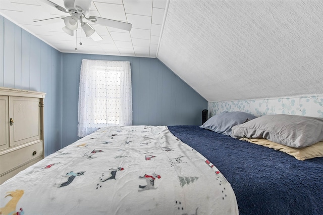 bedroom with ceiling fan and lofted ceiling