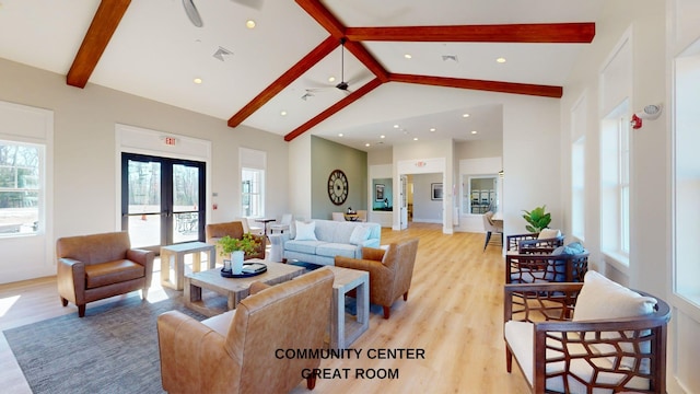 living room with french doors, ceiling fan, light wood-type flooring, and beamed ceiling