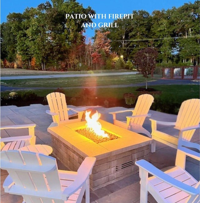 view of patio / terrace with a fire pit