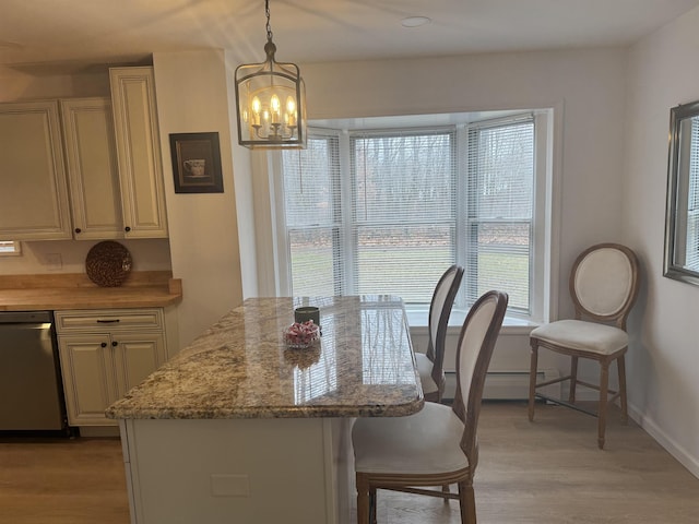 dining area with light hardwood / wood-style floors and baseboard heating