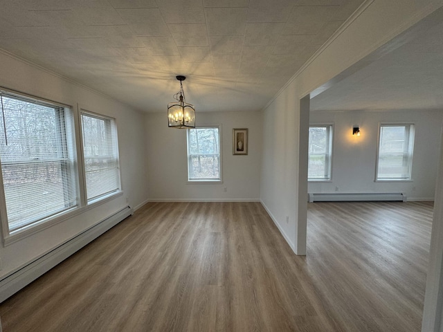 unfurnished dining area with a baseboard radiator, light hardwood / wood-style flooring, and a notable chandelier