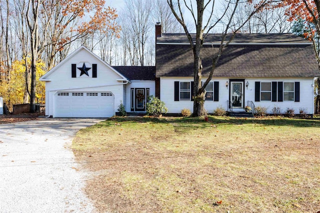 view of front of house featuring a garage and a front yard