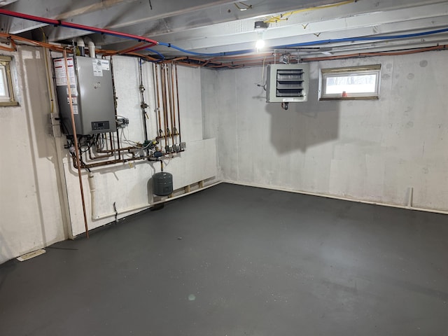 basement featuring tankless water heater