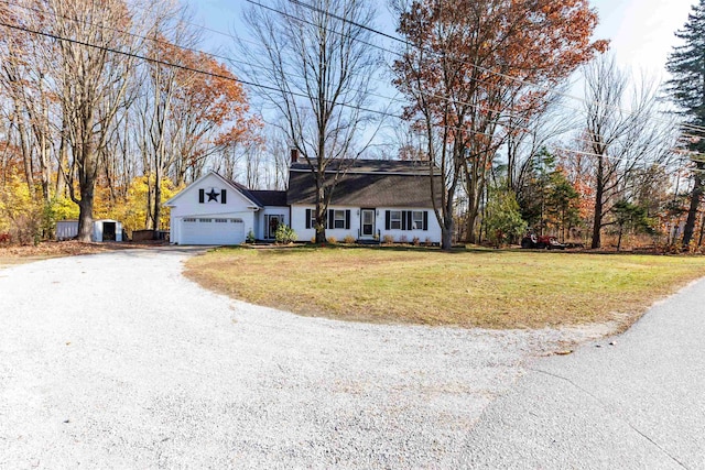 single story home featuring a garage and a front yard