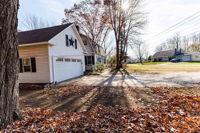 view of side of property featuring a garage