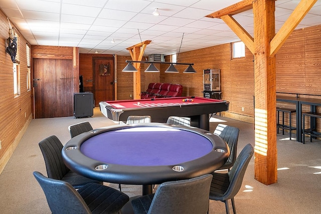 rec room with light colored carpet, pool table, and wood walls