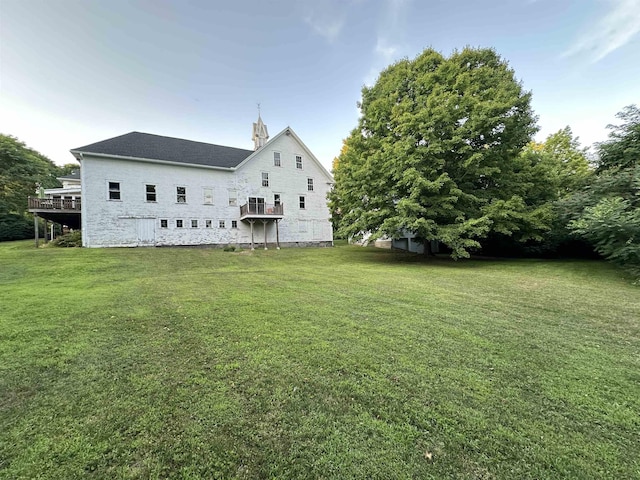 rear view of house with a lawn