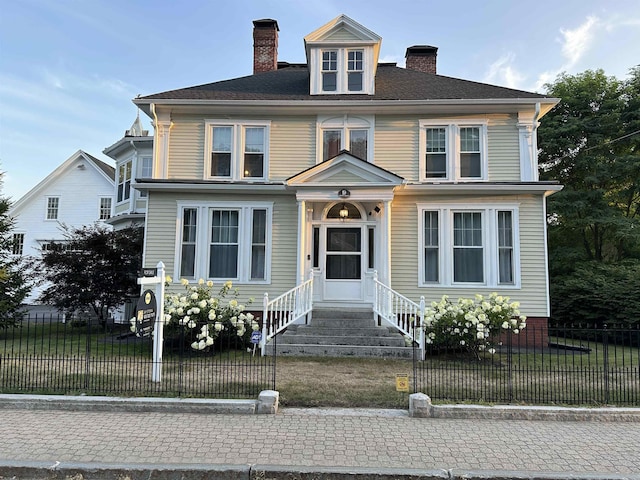 view of front of home with a front lawn