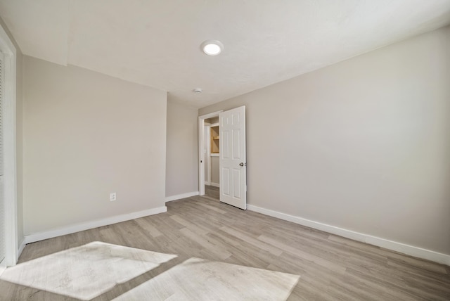 unfurnished room featuring light hardwood / wood-style floors