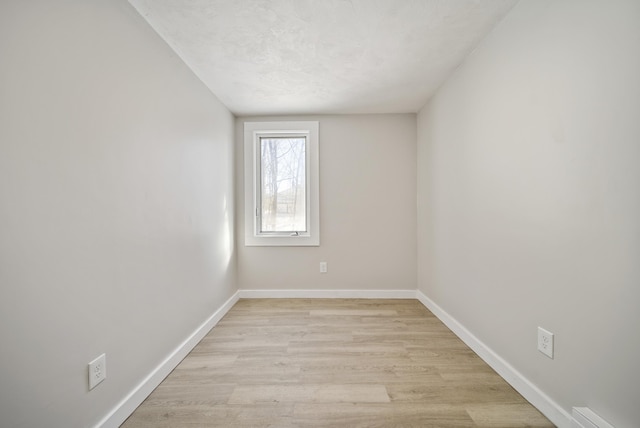 unfurnished room with light hardwood / wood-style flooring