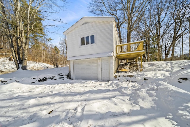 exterior space featuring a garage and a deck