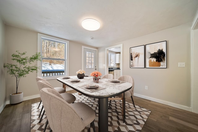 dining area with dark wood-type flooring