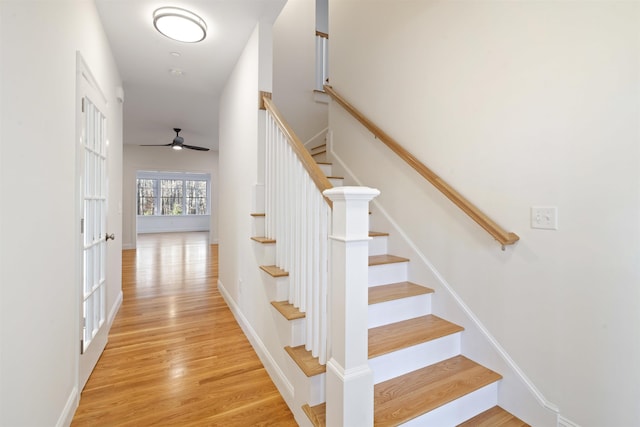 stairs featuring hardwood / wood-style flooring