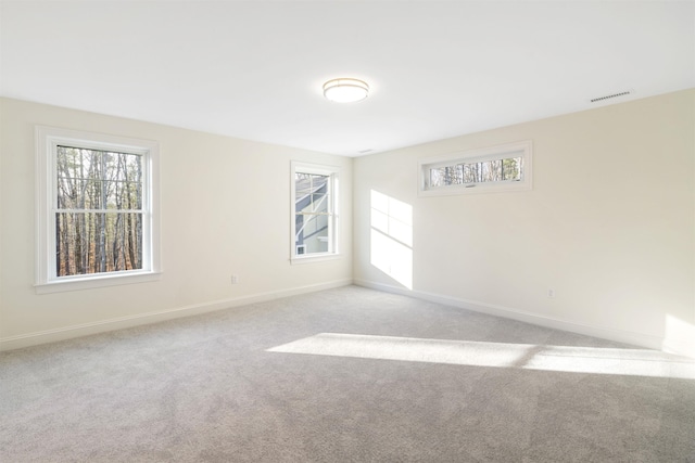 empty room with light colored carpet