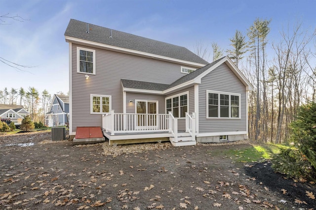 back of house featuring a wooden deck and central air condition unit